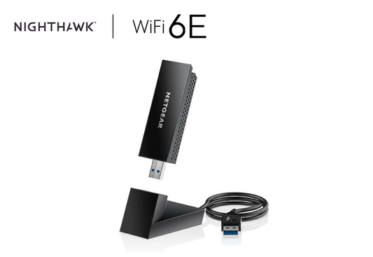An image displaying the Nighthawk A8000 - AXE3000 WiFi 6E USB 3.0 Adapter, a compact device designed to provide high-speed wireless internet connectivity. Its sleek design features USB 3.0 connectivity for seamless integration with various devices.