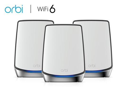 An image showcasing the NETGEAR Orbi Whole Home Tri-band Mesh Wi-Fi 6 System (RBK853), including a router and two satellite extenders. Offering coverage for up to 7,500 square feet and supporting connectivity for 100 devices, this system delivers AX6000 speeds of up to 6Gbps. Designed for comprehensive home Wi-Fi coverage, ensuring seamless connectivity throughout the household.