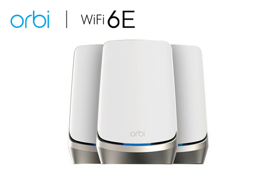 An image presenting the AXE11000 Mesh WiFi System (RBKE963), part of the Orbi 960 Series Quad-Band WiFi 6E Mesh System. This 3-pack system offers speeds of up to 10.8Gbps and includes a 10 Gigabit Ethernet port. Additionally, it comes with a 1-year NETGEAR Armor subscription included, ensuring robust security for your network.